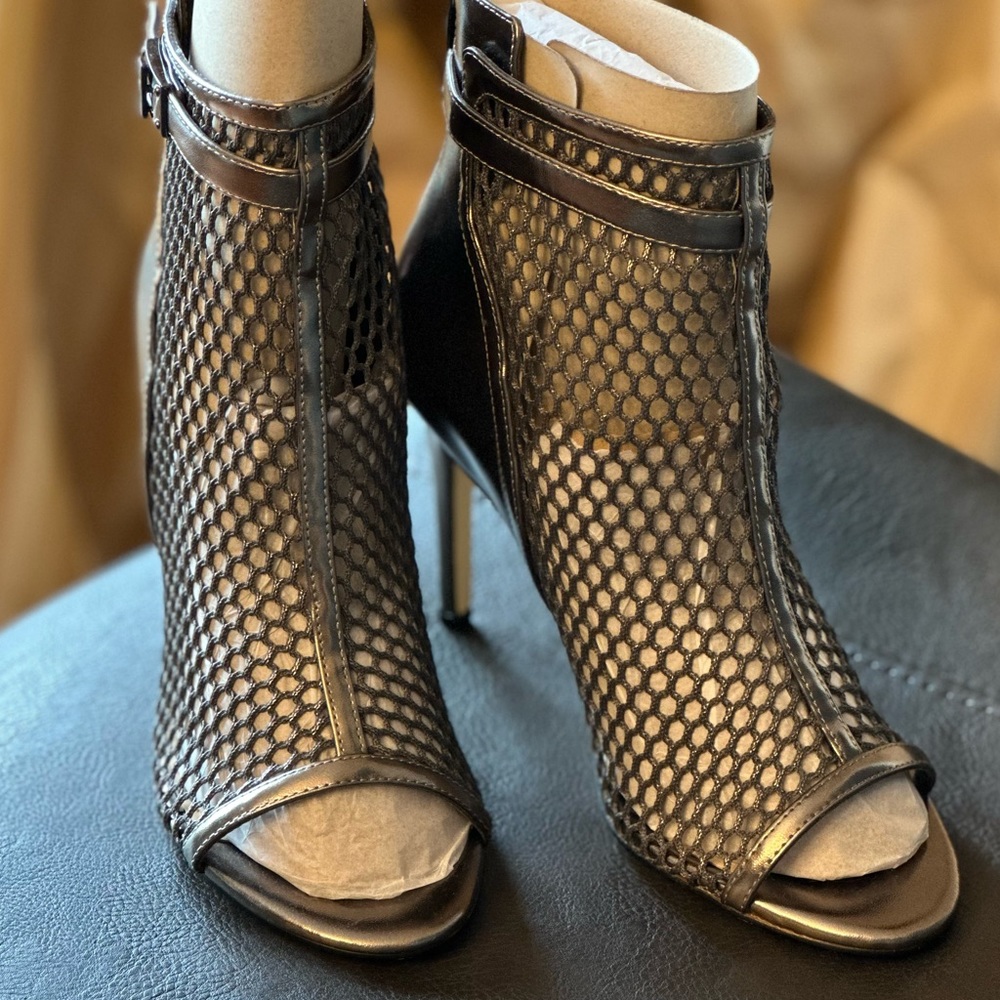 Mesh peep-toe booties by Nine West. Brand new, never worn. Silver, size 7.5.